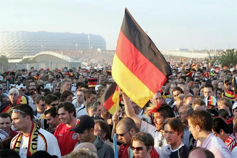 German football fans wearing national colors during World Cup match day
