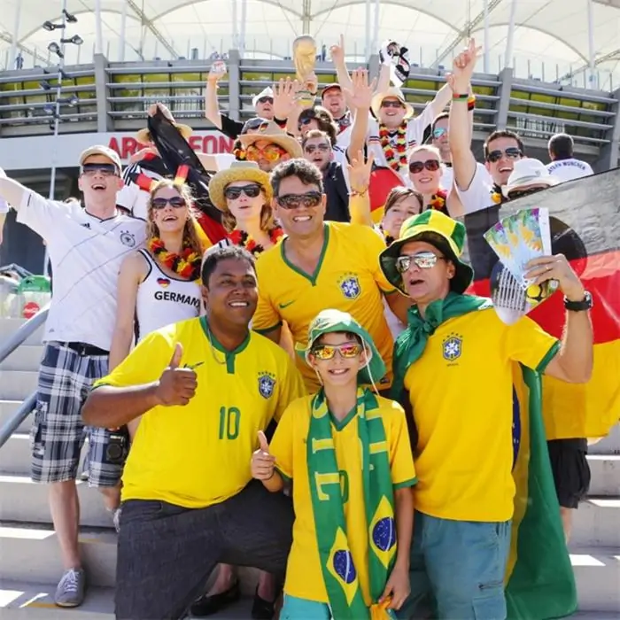 Brazil and Germany football fans wearing national team colors